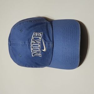 Nike, baseball hat light blue, with Nike Swoosh.